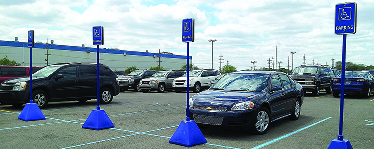 Blue plastic pyramid parking sign bases