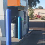 Blue plastic Bollard Covers providing ATM protection