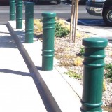 Metro Decorative Bollard Covers used for pedestrian protection in a parking lot