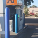 Clean ATM guarded by dome top bollard covers