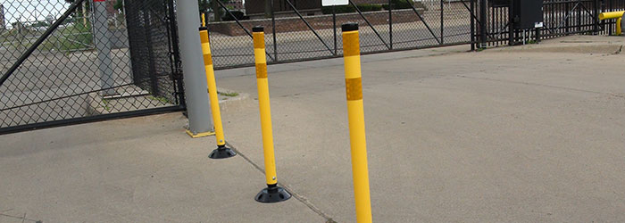 Yellow plastic delineator posts used for traffic control