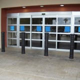 Steel pipe bollards with Metro Decorative Bollard Covers providing storefront protection