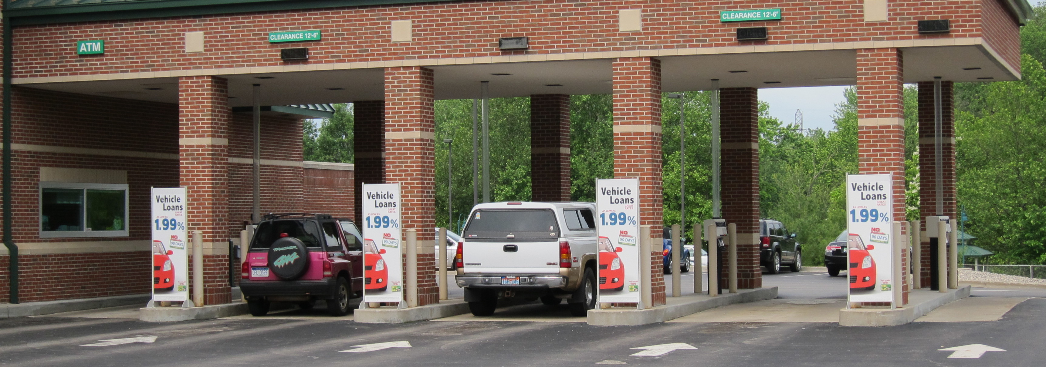 Bank drive-through lanes with promotional banners