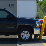 Flexpost Bollard flexing upon vehicle impact and returns upright when vehicle backs away