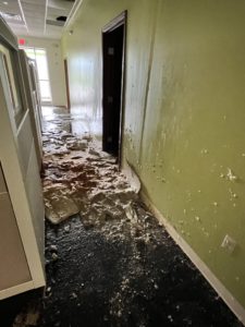 Burst sprinkler pipe damage from ceiling on floor